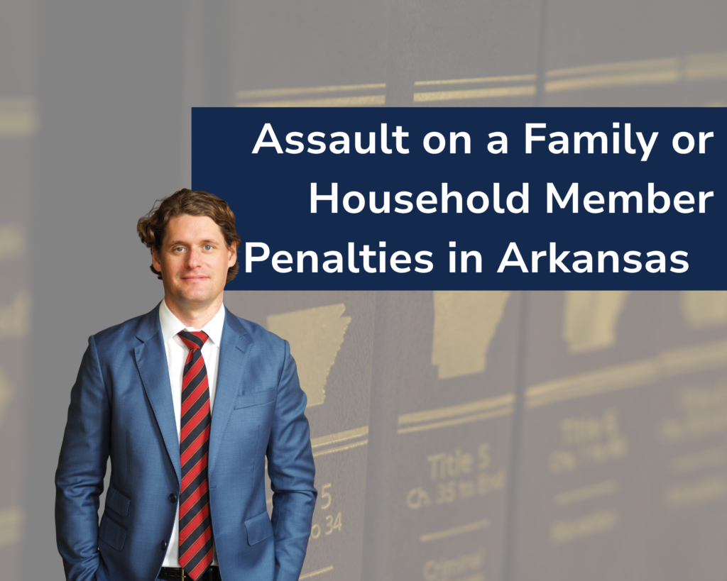 Criminal attorney Kale Ludwig in blue suit with red tie in the foreground, close-up of the Arkansas Code Annotated in the background.
