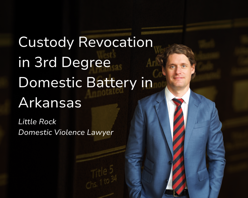Compare domestic battery and assault on a family or household member in Arkansas, including penalties, record sealing, and firearm consequences. This is a title graphic. Little Rock criminal defense attorney Kale Ludwig stands in the foreground wearing a blue suit and red tie, while a close-up of the Arkansas Criminal Code Annotated is in the background. The title of this blog is "Is Domestic Battery Worse Than Domestic Assault in Arkansas?"
